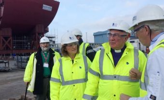 Steve 'JJ' MacKenzie project engineer for Babcock International at Rosyth tells the Moderator and Mrs Morrison about construction of two new aircraft carriers. Rev Alec Shuttleworth is at left.